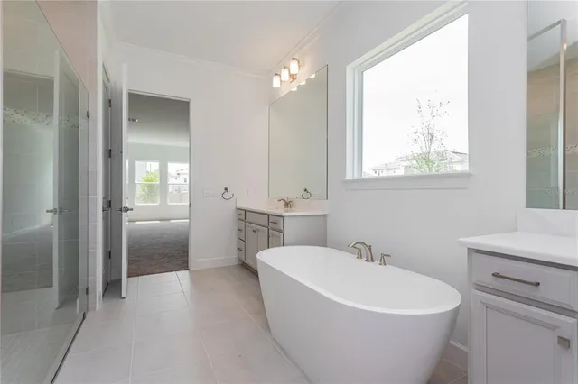 a white bath tub sitting next to a white sink