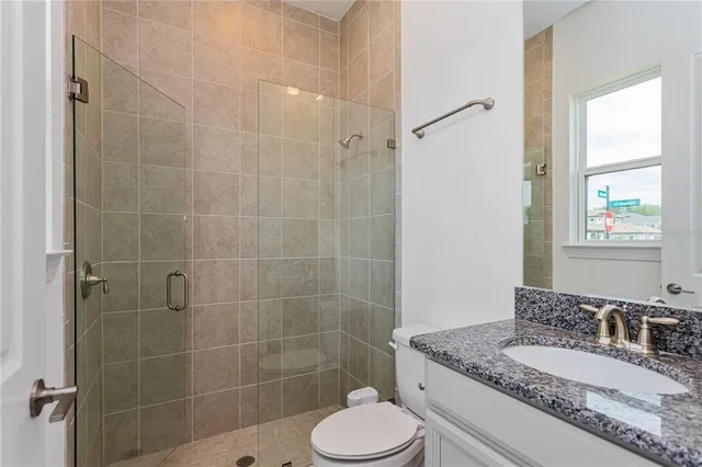 a bathroom with a toilet and shower