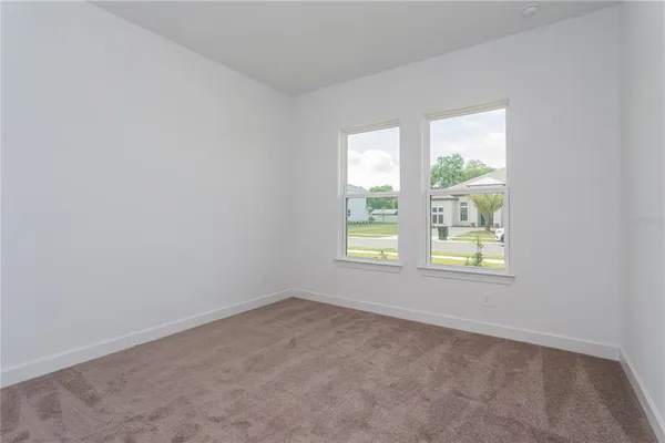 an empty room with closet area