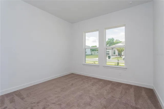 an empty room with closet area