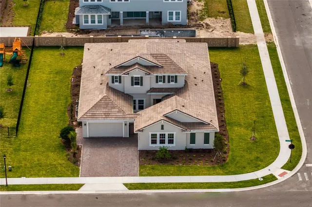 an aerial view of a house with swimming pool