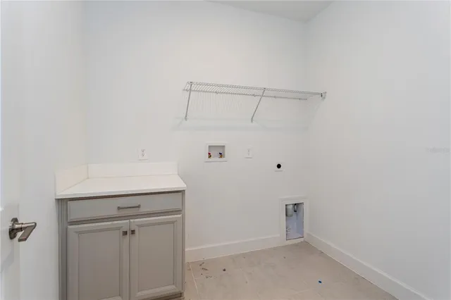 a view of a swimming pool with a bench and trees
