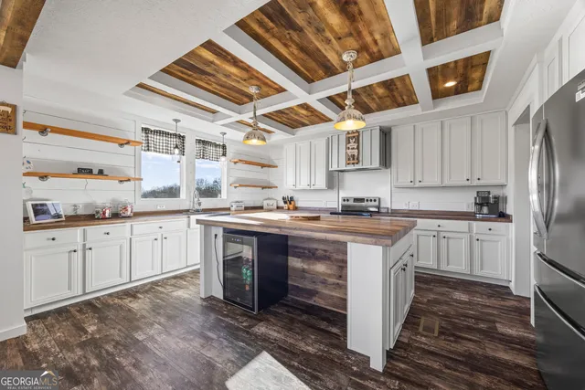 a spacious bedroom with a bed and a window