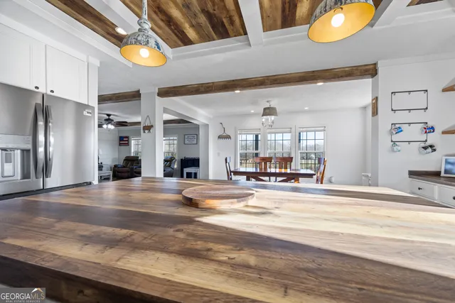 a view of a swimming pool with an outdoor seating