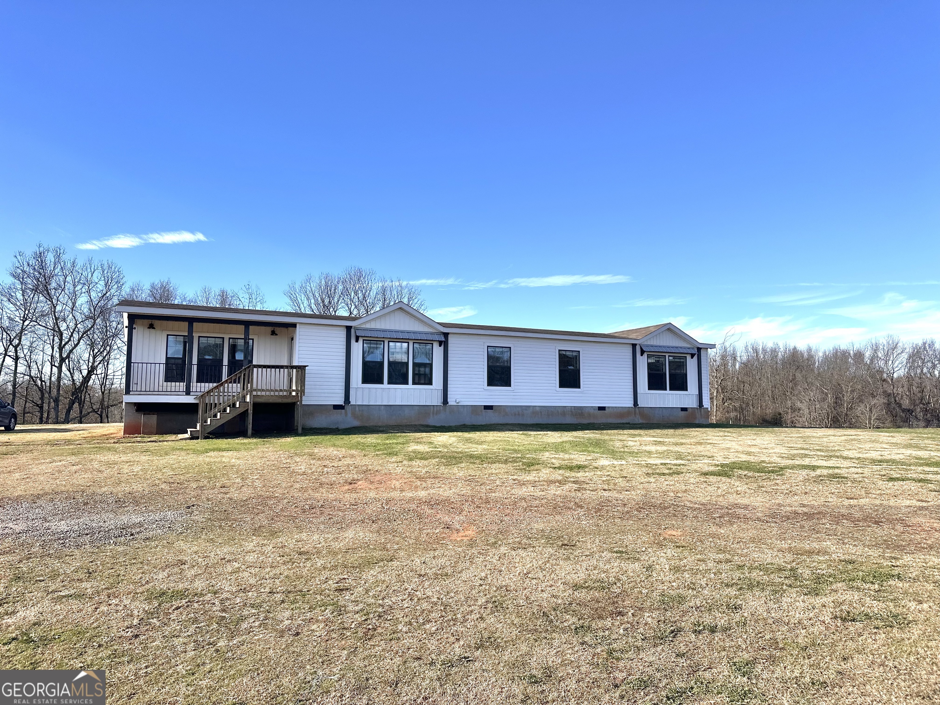 1029 Joe Cooper Road Danielsville, GA 30633 - Photo 77 of 78 a big house with large tree in front of it