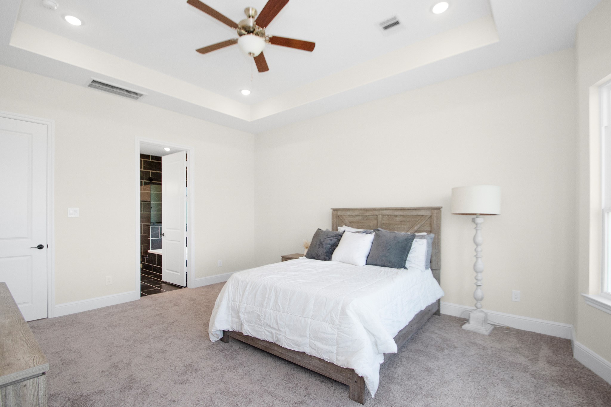 281 Brahman Trail Angleton, TX 77515 - Photo 22 of 43 a bedroom with a bed and a ceiling fan