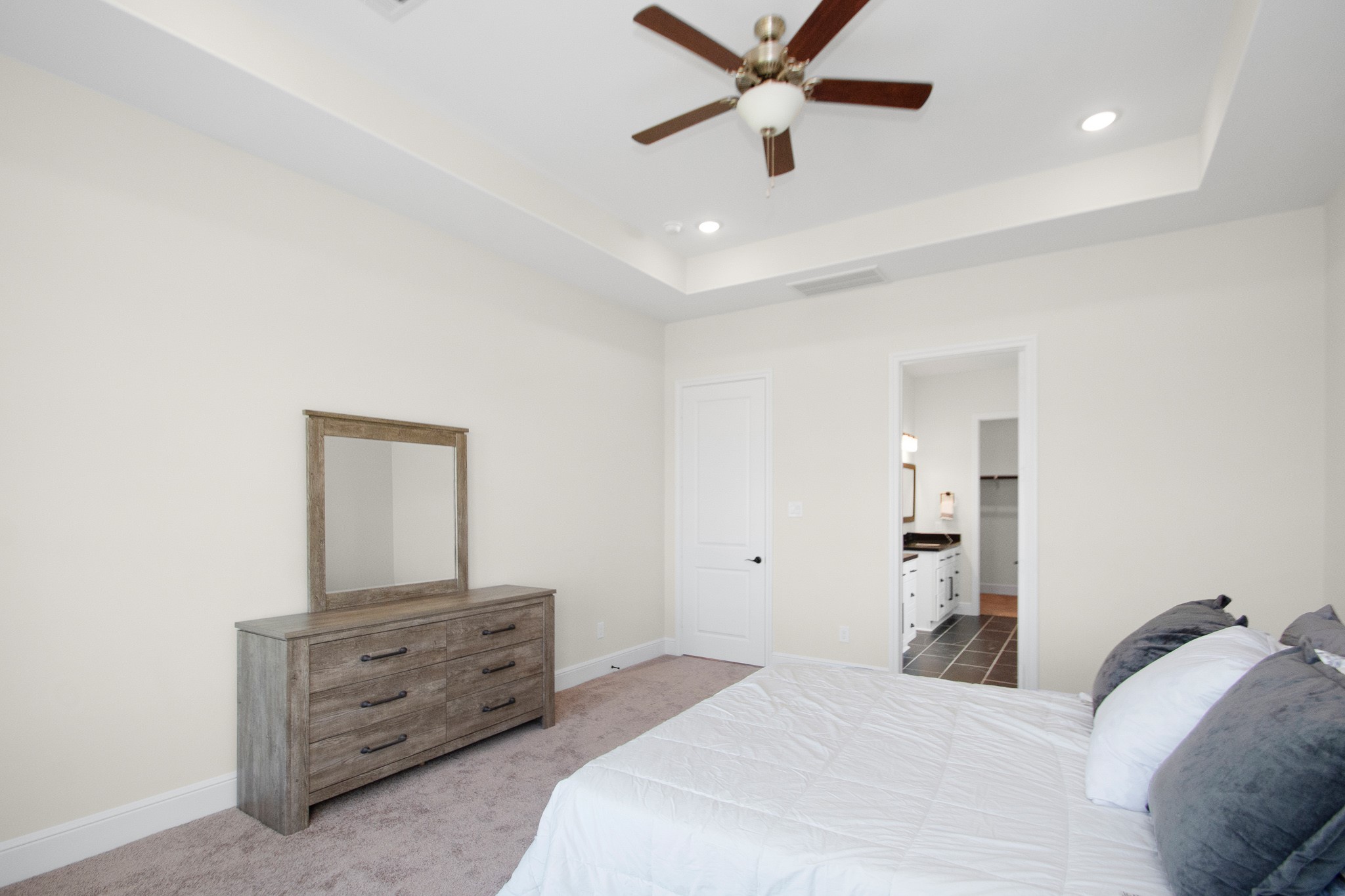 281 Brahman Trail Angleton, TX 77515 - Photo 23 of 43 a bedroom with a bed and a dresser