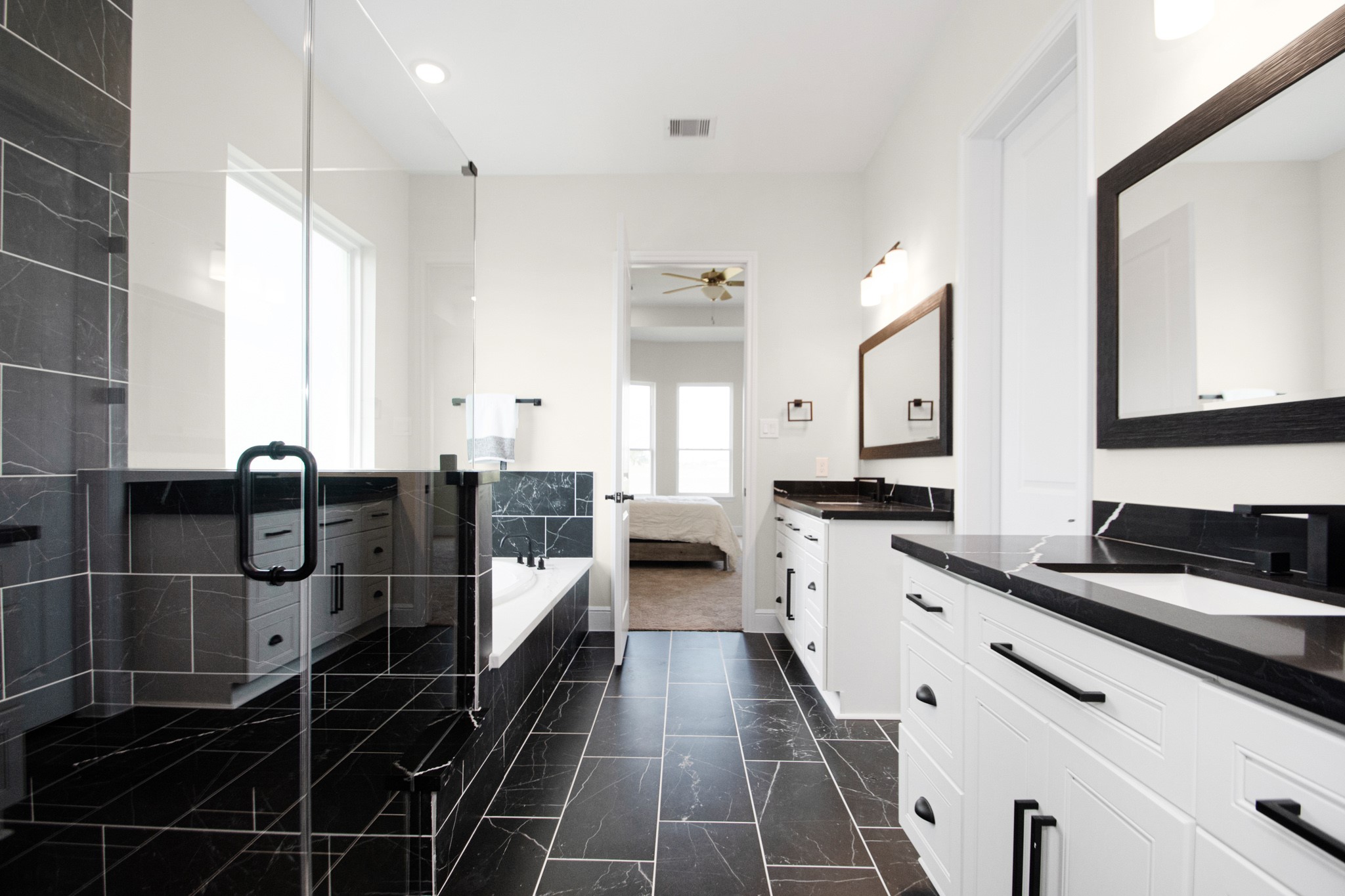 281 Brahman Trail Angleton, TX 77515 - Photo 28 of 43 a bathroom with a double vanity sink and mirror