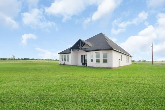 a house with garden in front of it