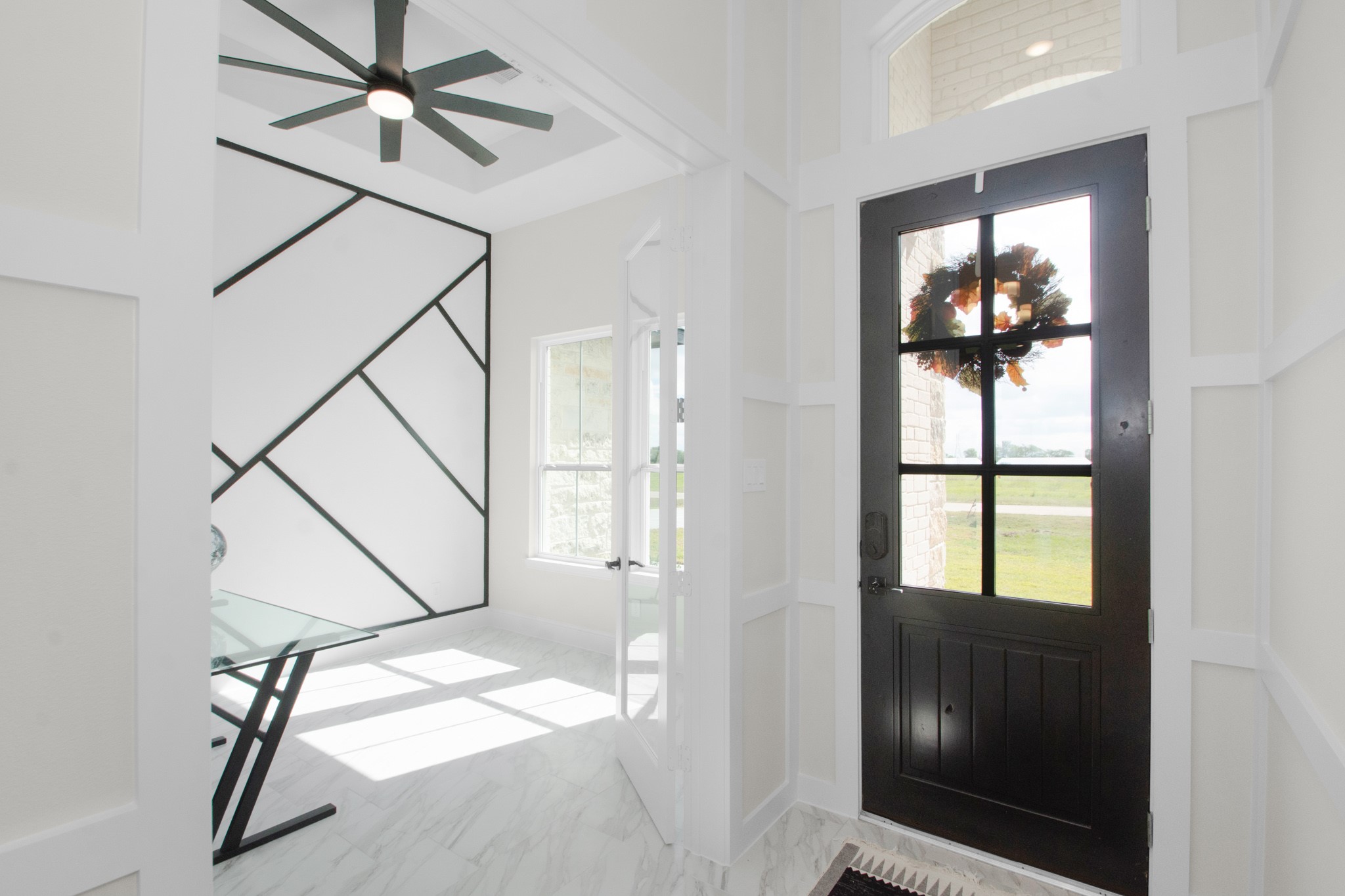 281 Brahman Trail Angleton, TX 77515 - Photo 38 of 43 a view of a livingroom with a window and a ceiling fan