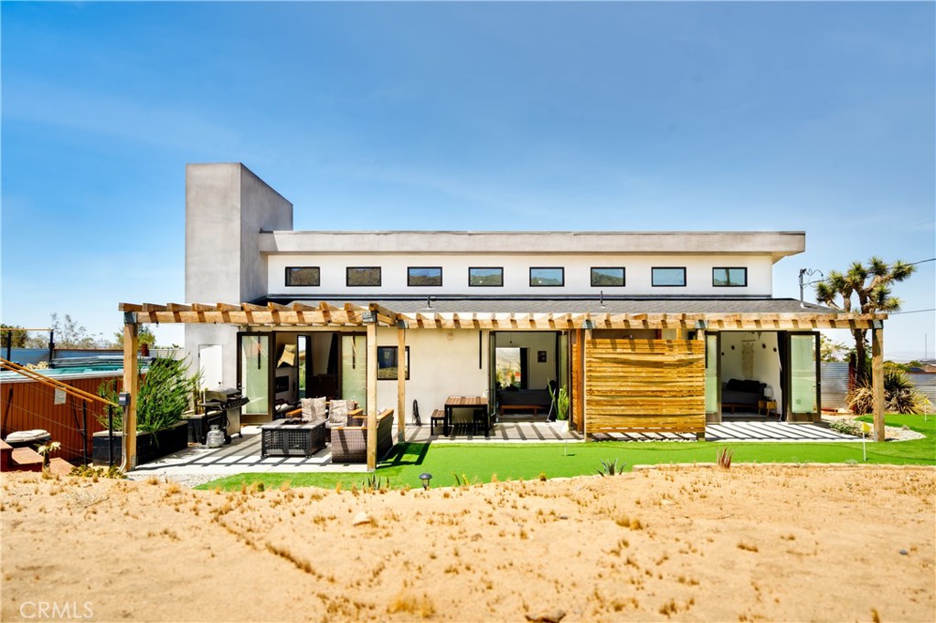60423 La Mirada Trail Joshua Tree, CA 92252 - Photo 24 of 29 a view of a house with a patio