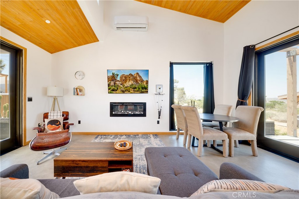 60423 La Mirada Trail Joshua Tree, CA 92252 - Photo 4 of 29 a living room with furniture and a large window
