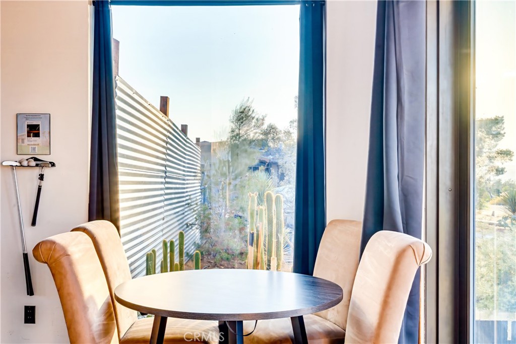 60423 La Mirada Trail Joshua Tree, CA 92252 - Photo 5 of 29 a view of a dining room with furniture and window