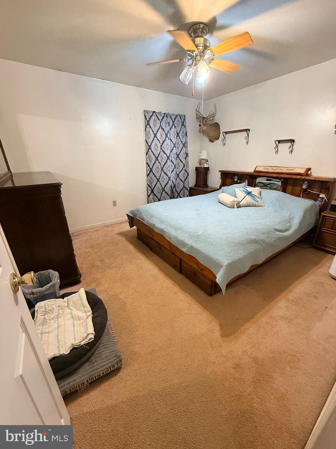 319 Canal Road Falling Waters, WV 25419 - Photo 11 of 29 a bedroom with a bed and a chandelier