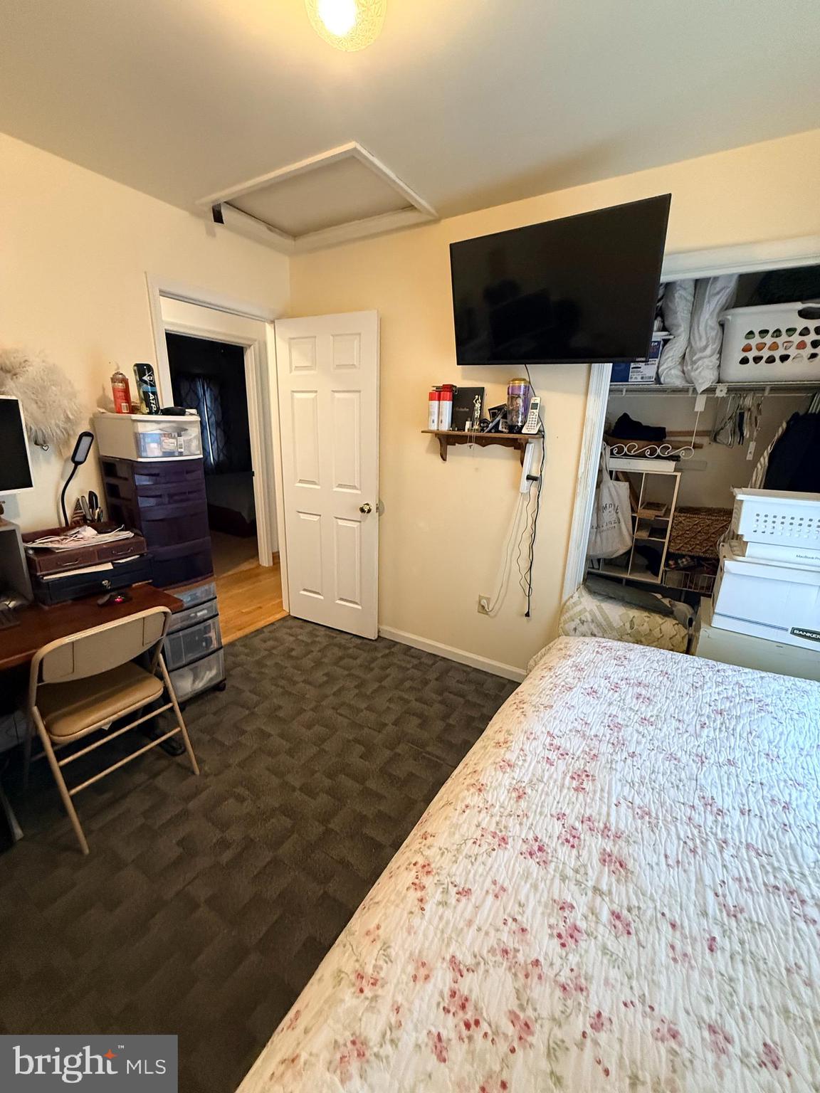 319 Canal Road Falling Waters, WV 25419 - Photo 14 of 29 a bedroom with a bed and a flat screen tv