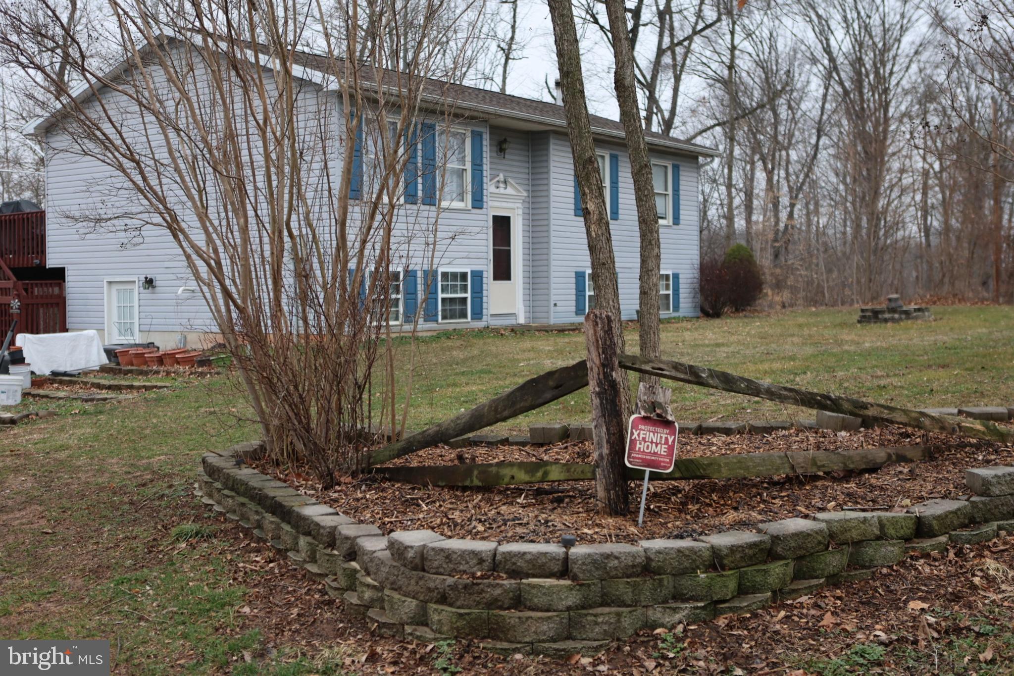 319 Canal Road Falling Waters, WV 25419 - Photo 2 of 29 a front view of a house with garden