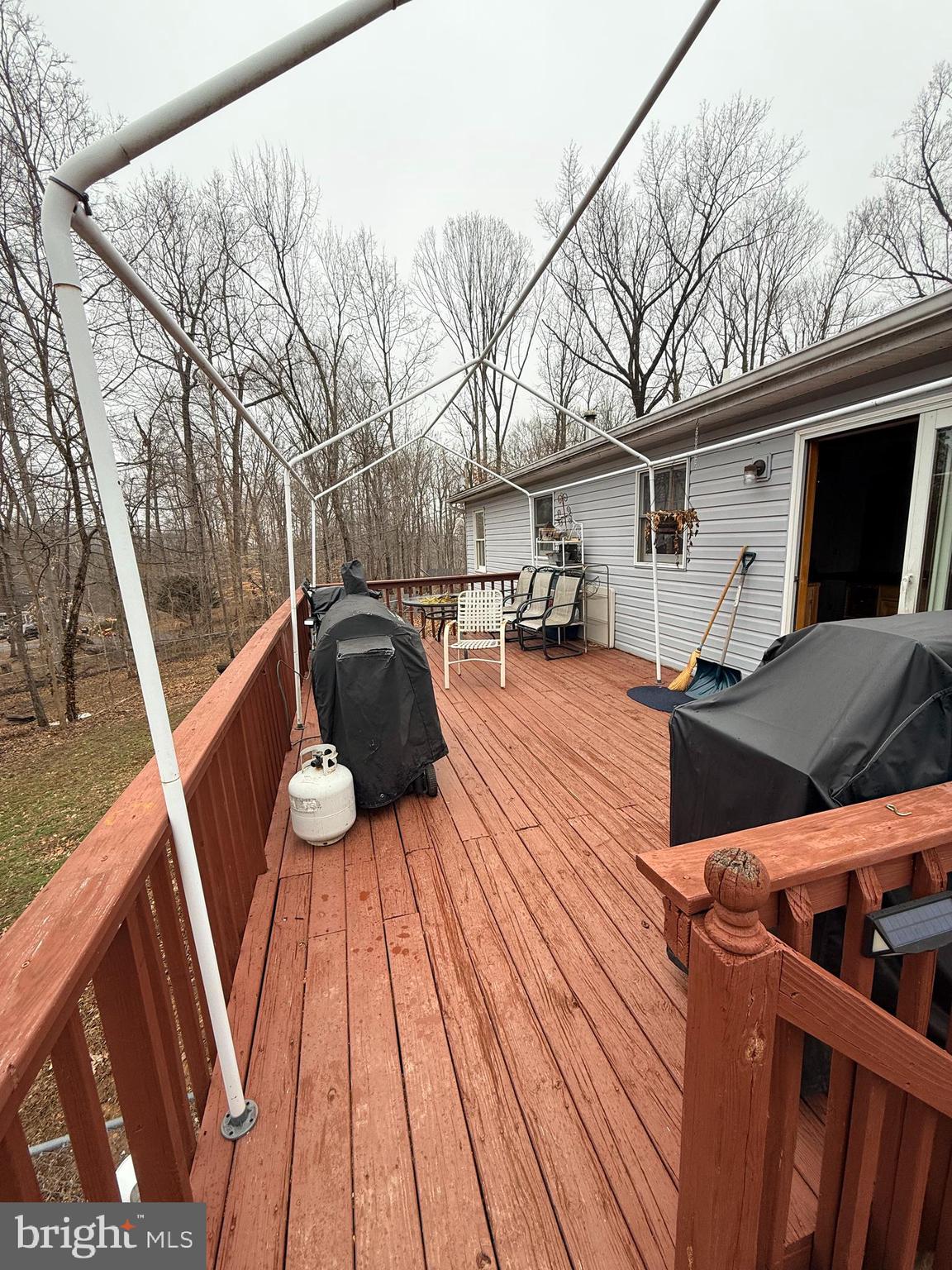 319 Canal Road Falling Waters, WV 25419 - Photo 25 of 29 a view of a deck with wooden floor and barbeque oven