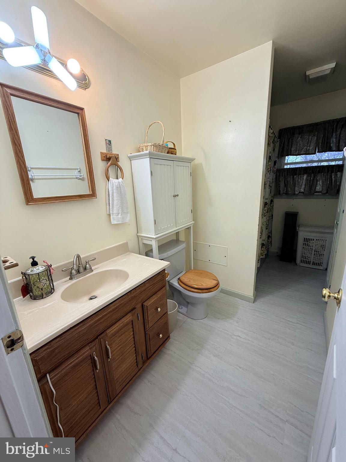 319 Canal Road Falling Waters, WV 25419 - Photo 10 of 29 a spacious bathroom with a double vanity sink toilet and a mirror