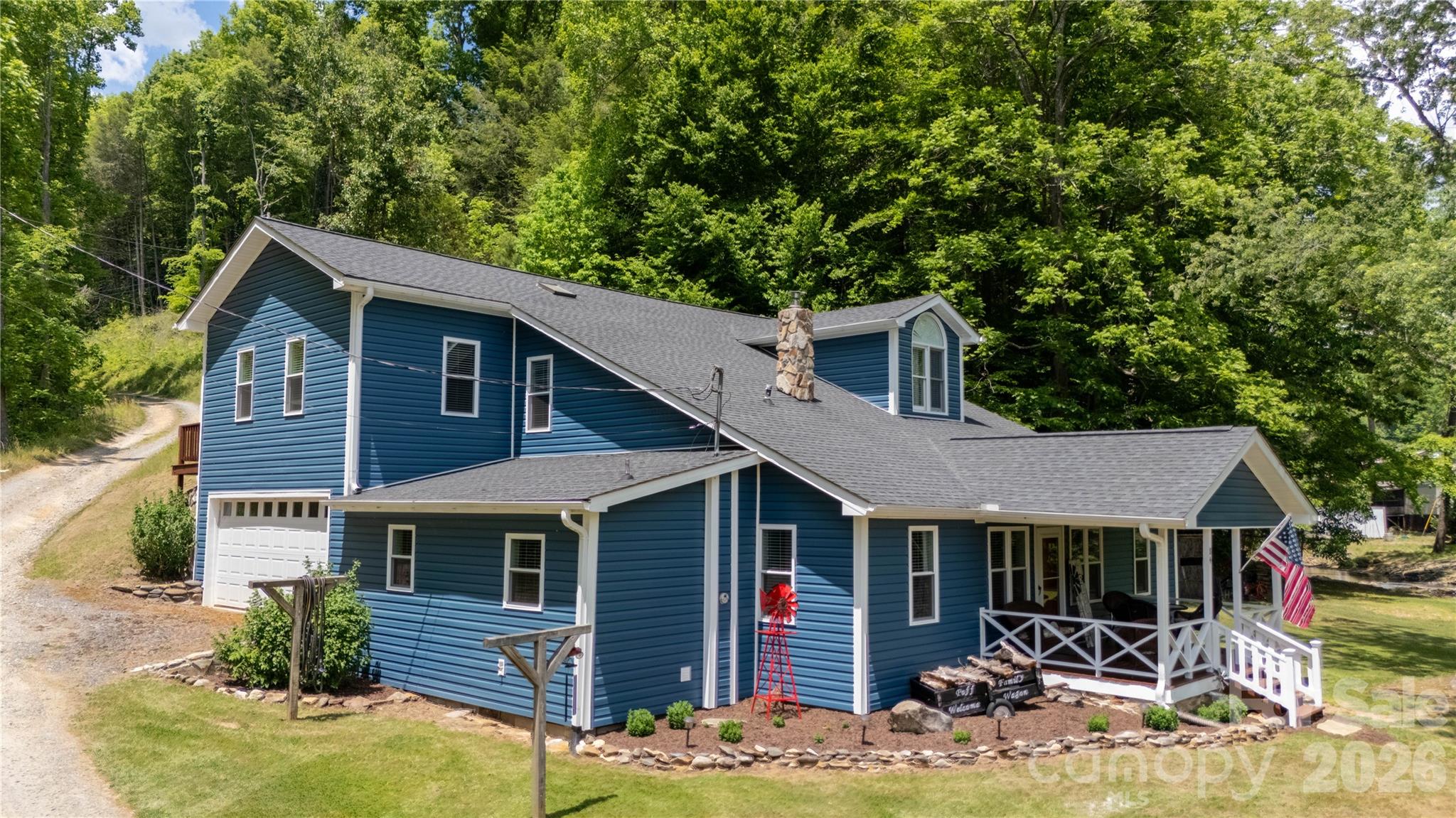 84 Sheets Farm Road Bakersville, NC 28705 - Photo 7 of 42 a front view of a house with yard