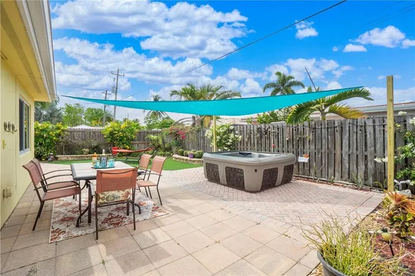 a view of an outdoor sitting area with furniture