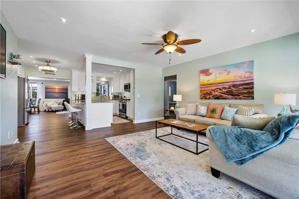 a living room with furniture and a large window
