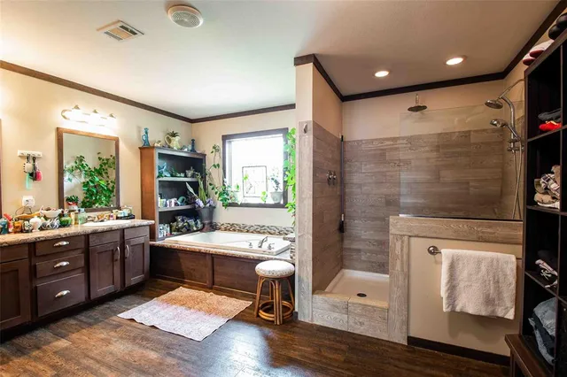 a large white kitchen with a large window