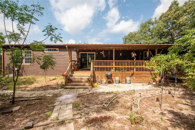 a view of a house with wooden fence