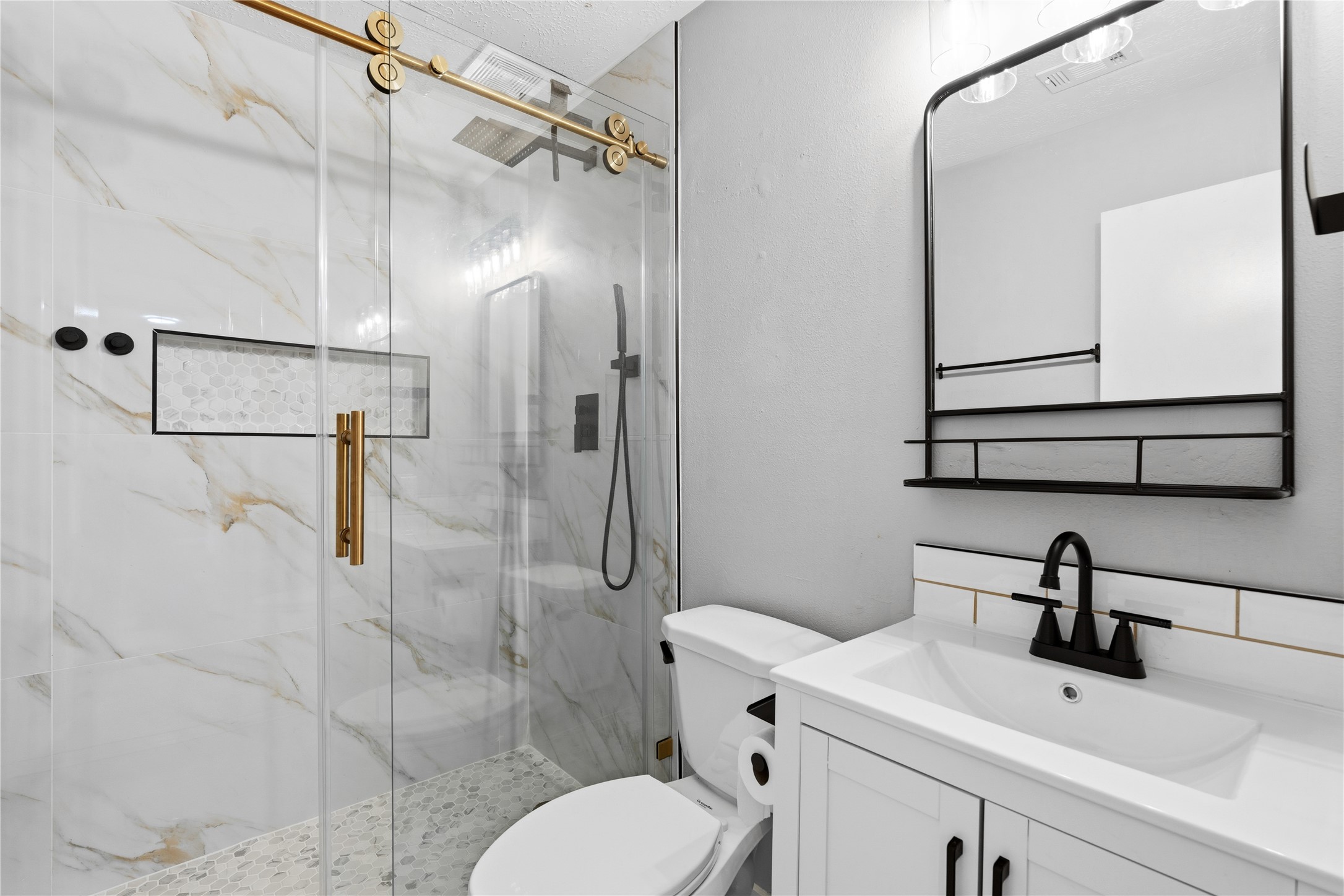 10422 Mist Lane Houston, TX 77070 - Photo 21 of 27 a bathroom with a sink toilet and shower