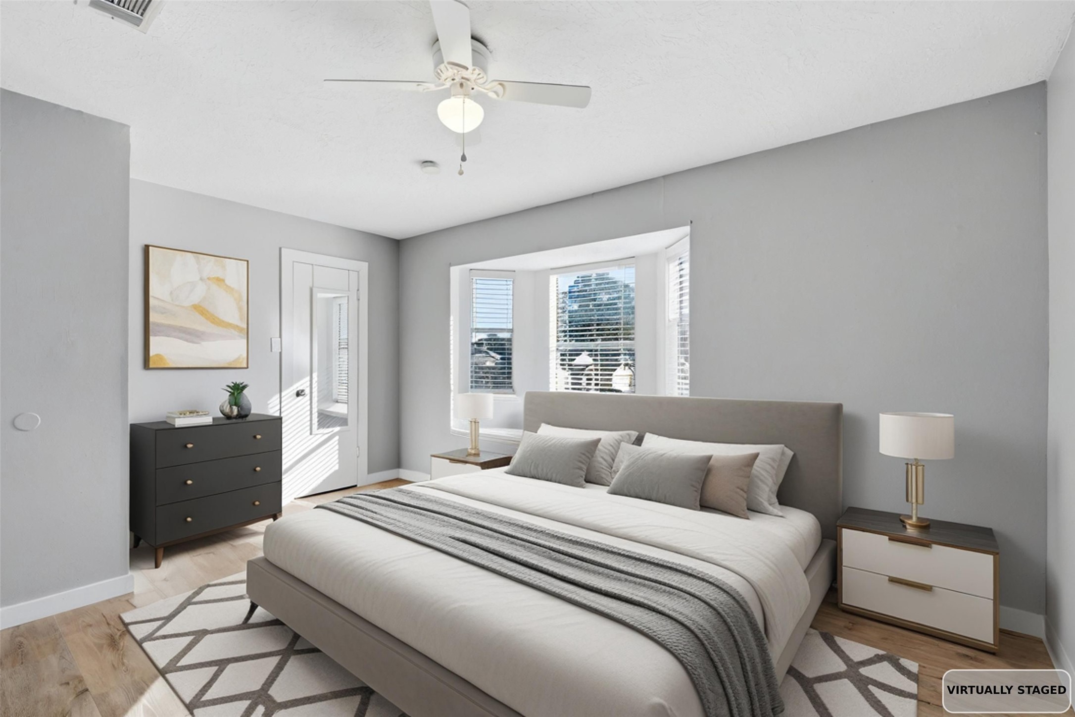 10422 Mist Lane Houston, TX 77070 - Photo 23 of 27 a bedroom with a bed and a lamp on dresser