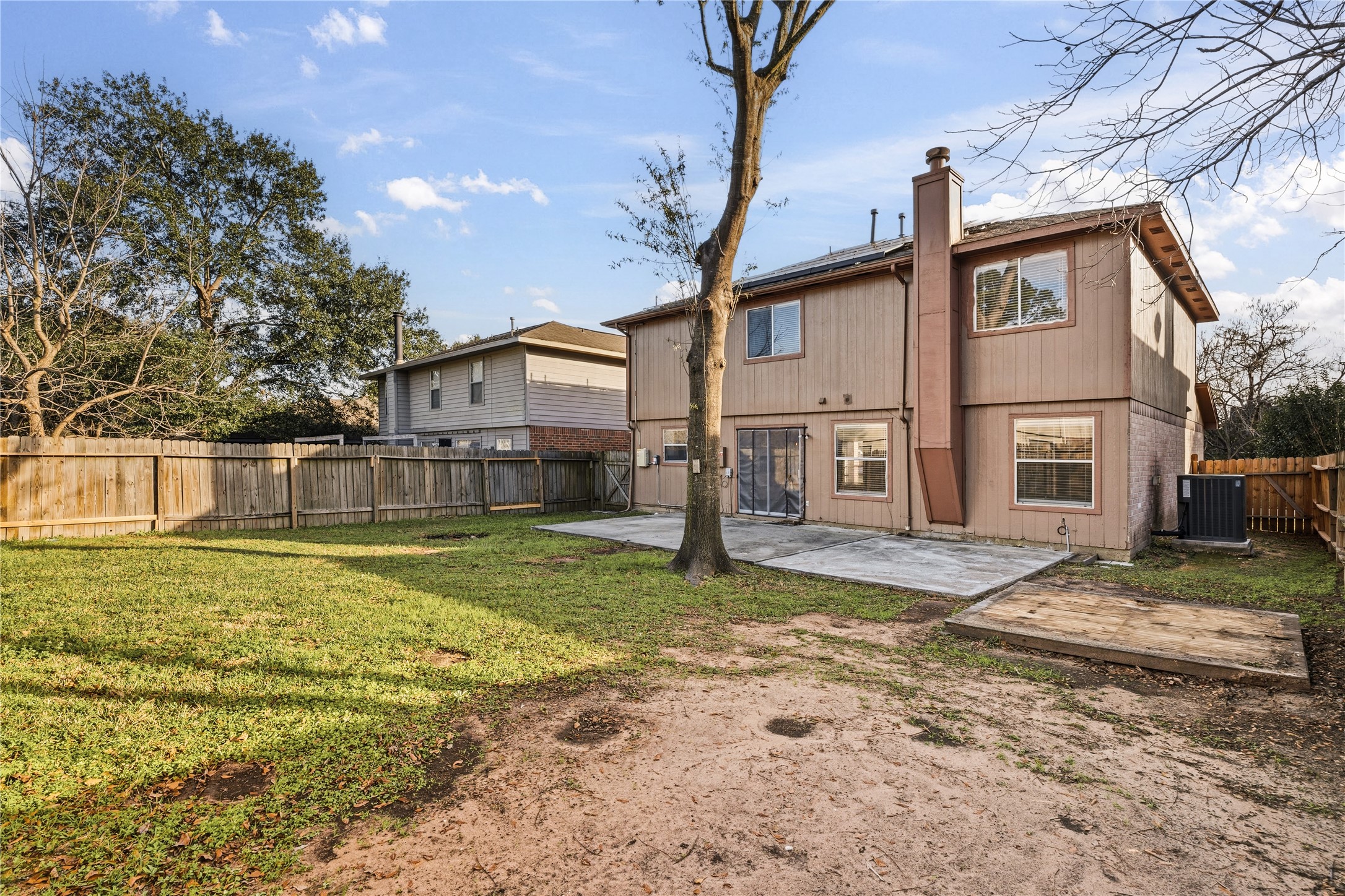 10422 Mist Lane Houston, TX 77070 - Photo 27 of 27 a view of a yard in front of a house with a large tree