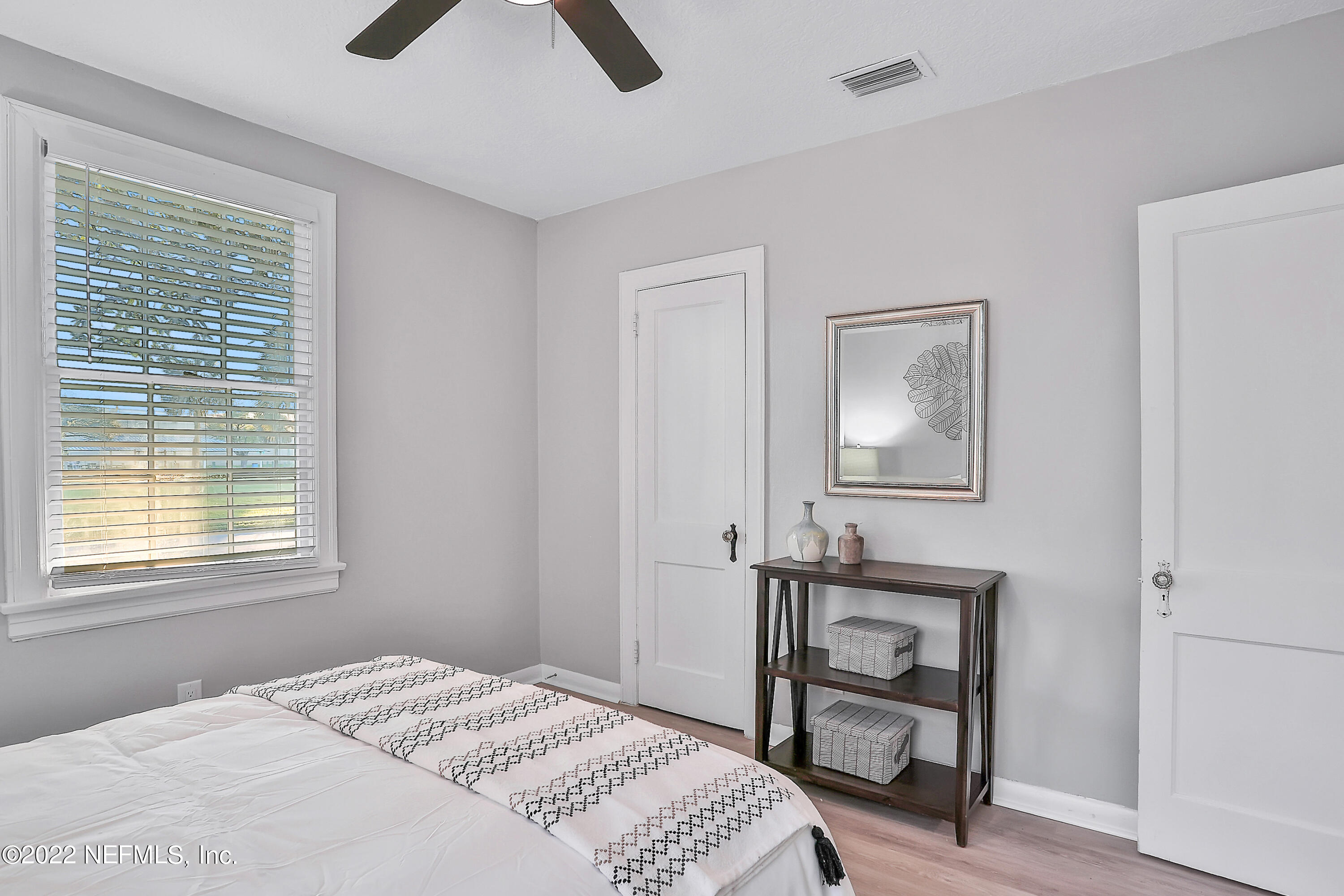 1961 Huntsford Road Jacksonville, FL 32207 - Photo 26 of 30 a bedroom with a bed and a window