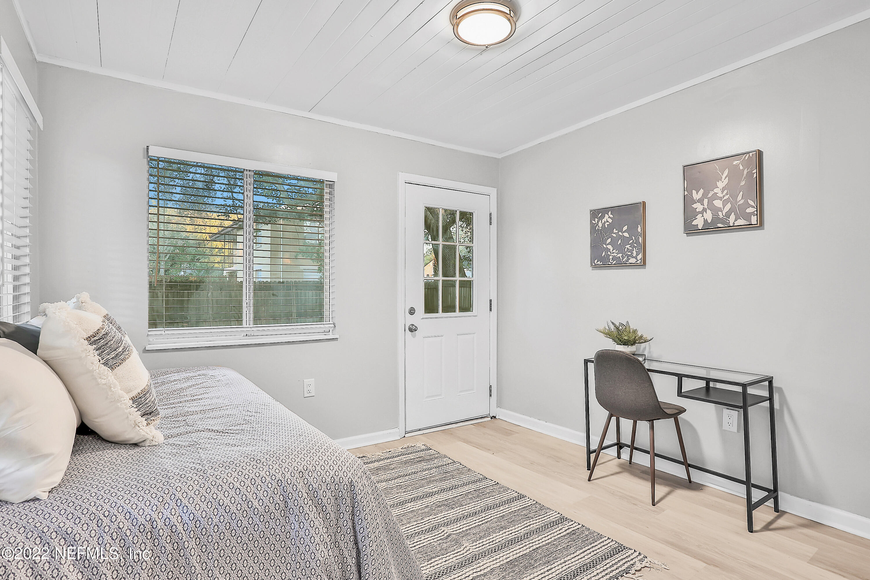 1961 Huntsford Road Jacksonville, FL 32207 - Photo 27 of 30 a bedroom with a bed and a window