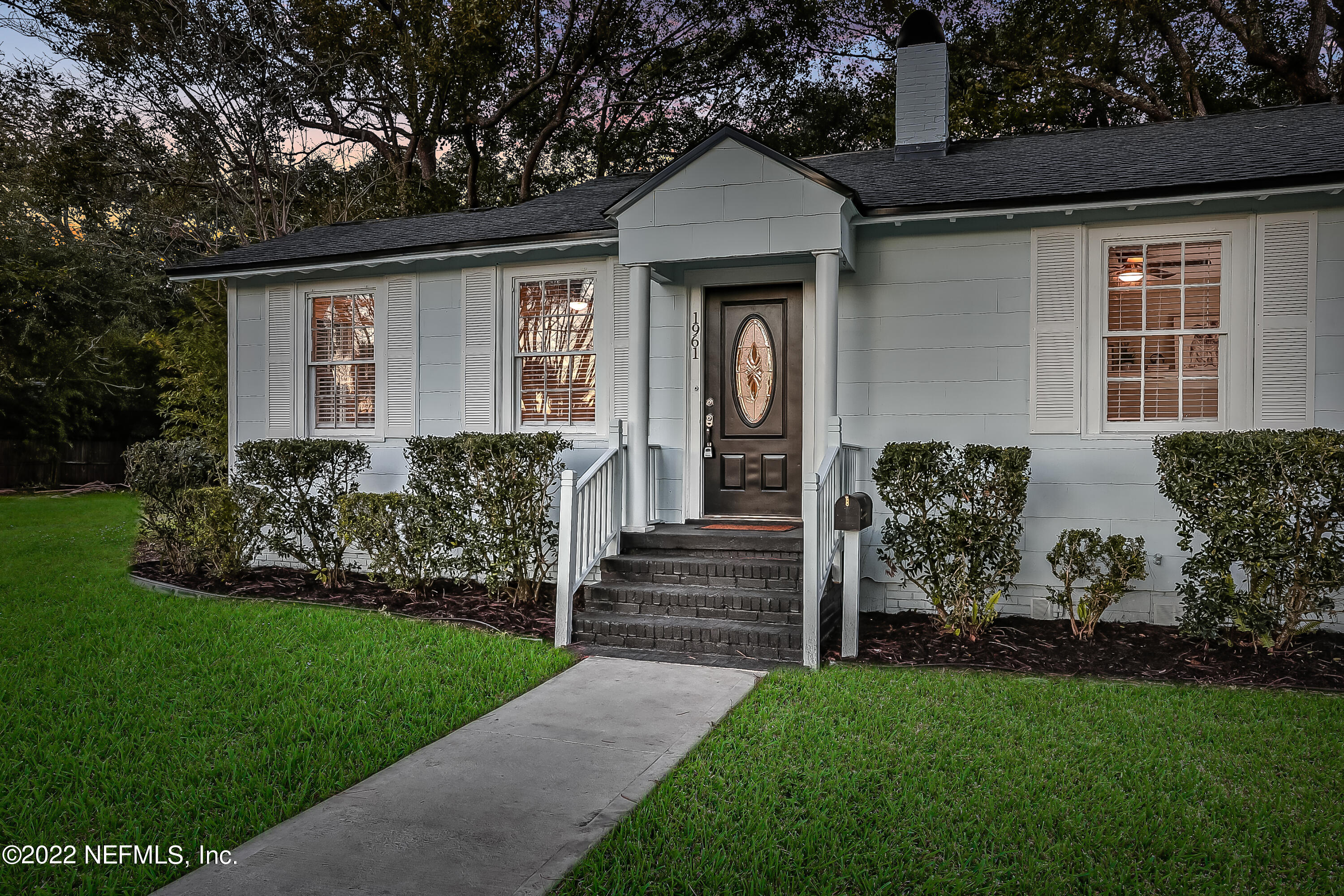 1961 Huntsford Road Jacksonville, FL 32207 - Photo 3 of 30 a front view of a house with a yard