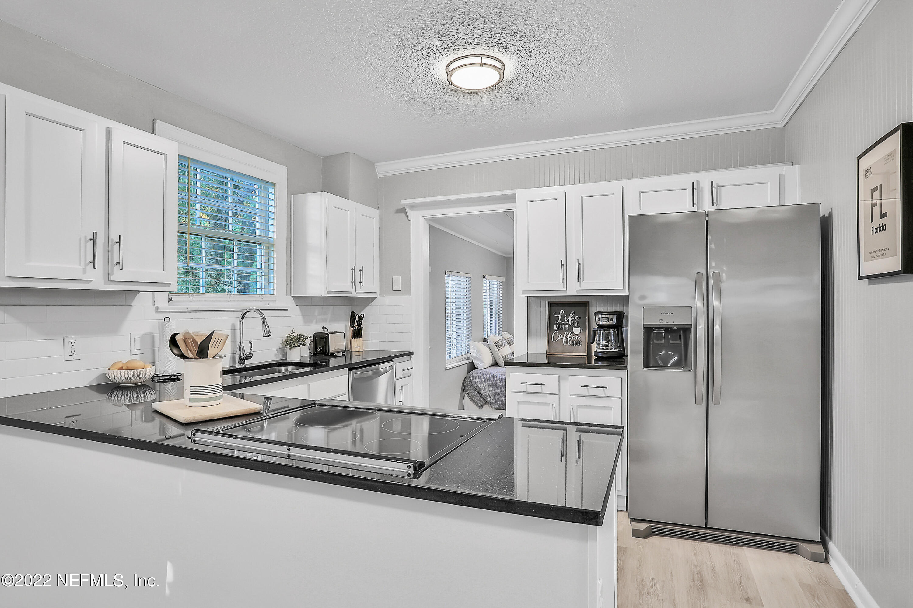 1961 Huntsford Road Jacksonville, FL 32207 - Photo 8 of 30 a kitchen with stainless steel appliances granite countertop a refrigerator sink and stove