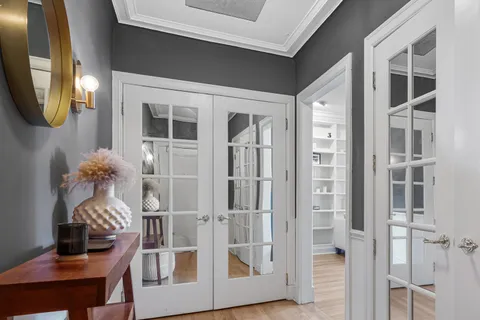 a view of a entryway of a livingroom with furniture and wooden floor
