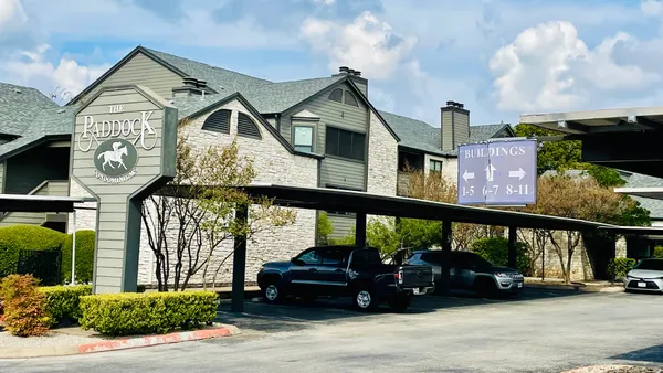 a view of a car park in front of house