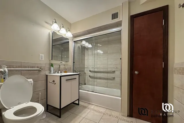 a view of washer and dryer in a bathroom