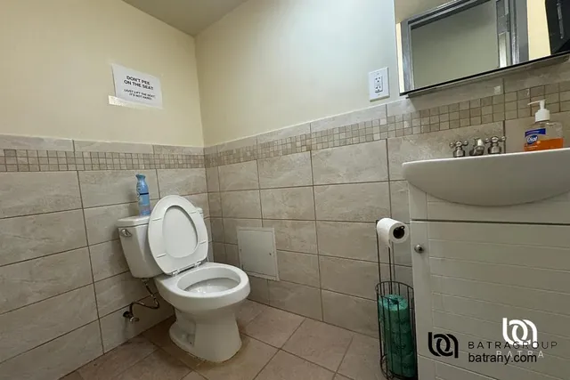 a bathroom with a toilet and a sink
