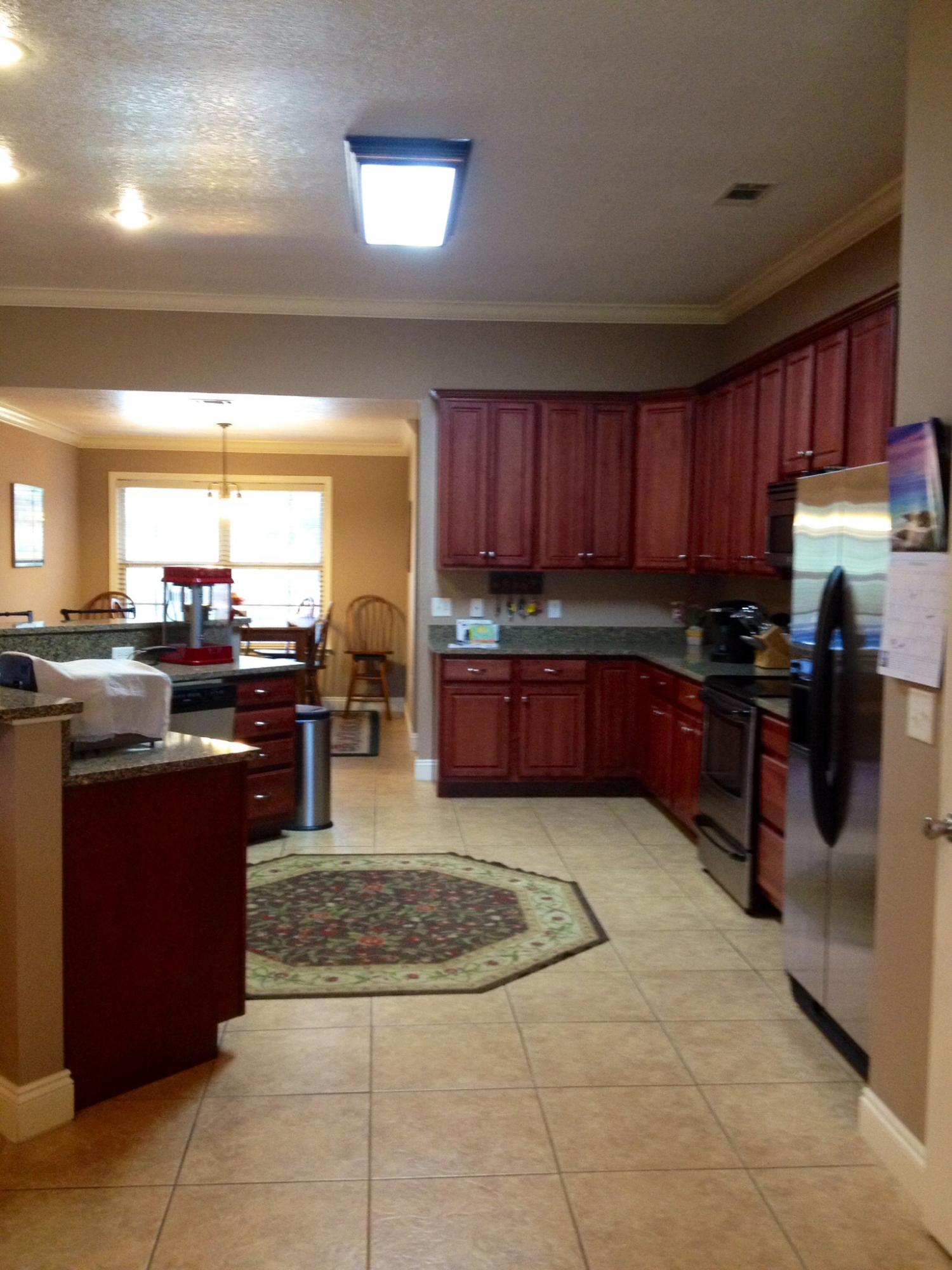 6589 Old River Road, Unit 3 ACRES Baker, FL 32531 - Photo 11 of 30 a kitchen with stainless steel appliances granite countertop a stove sink and cabinets
