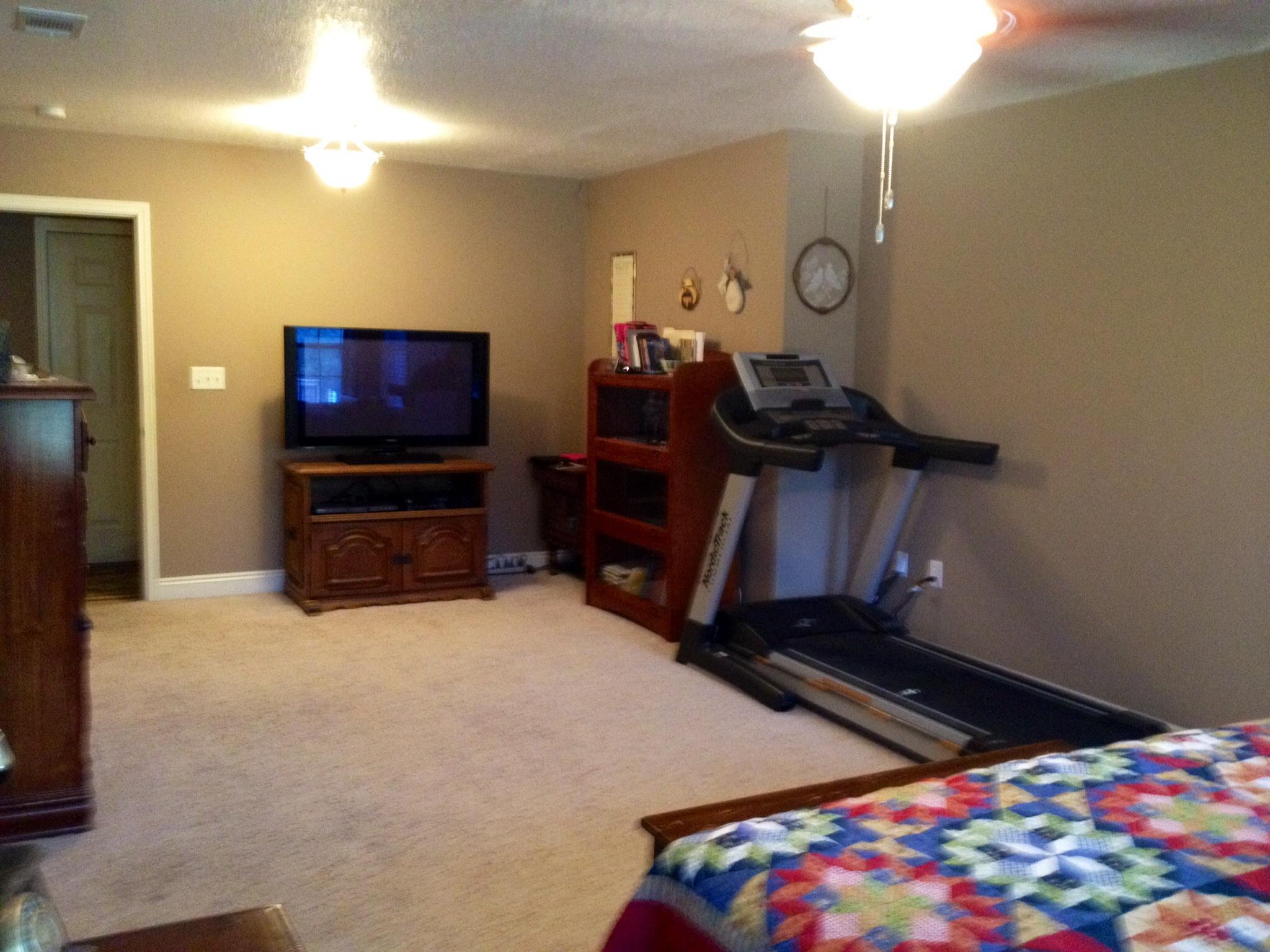 6589 Old River Road, Unit 3 ACRES Baker, FL 32531 - Photo 17 of 30 a bedroom with bed and a flat tv screen on dresser