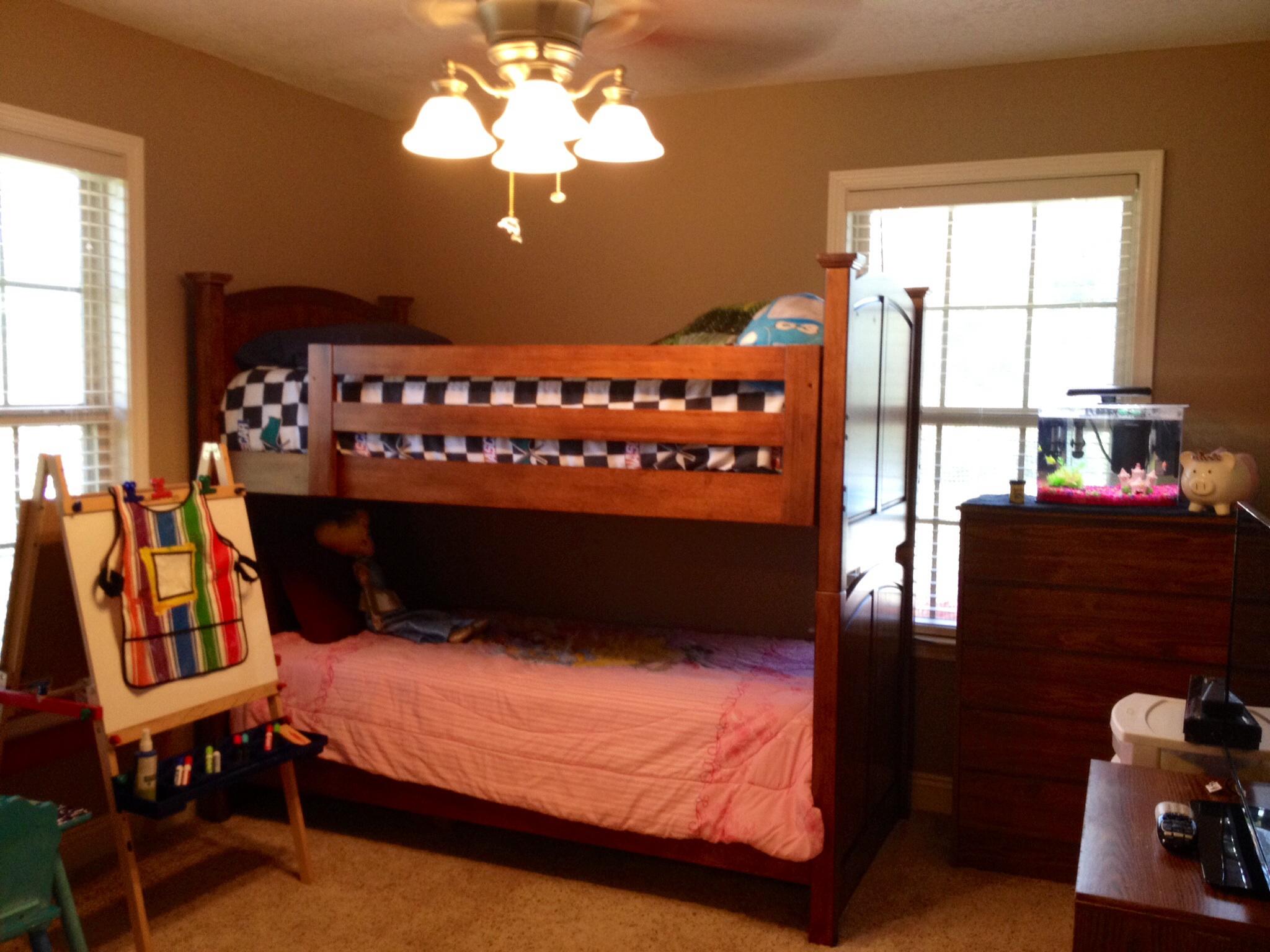 6589 Old River Road, Unit 3 ACRES Baker, FL 32531 - Photo 24 of 30 a bed sitting in a bedroom next to a window