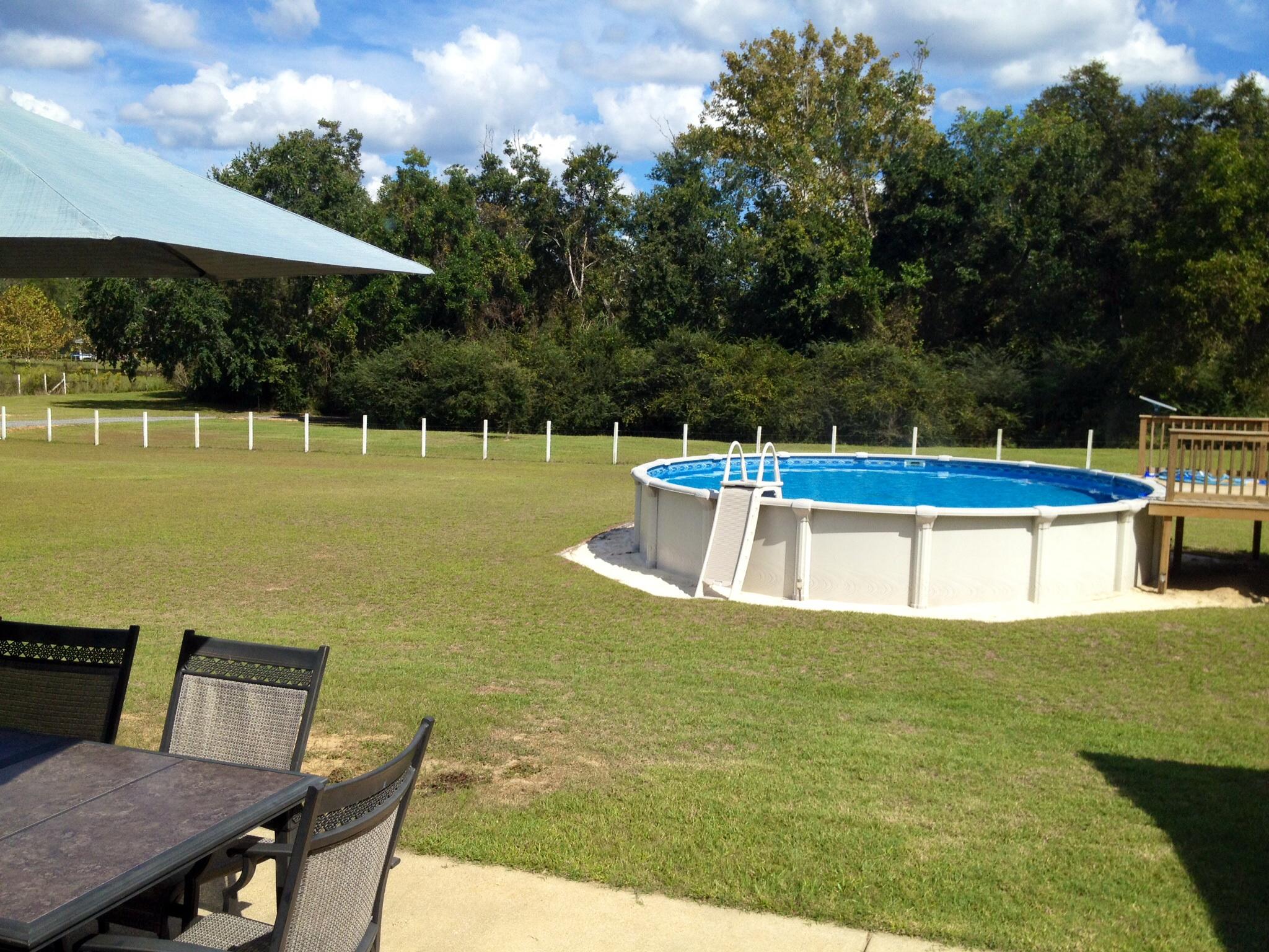 6589 Old River Road, Unit 3 ACRES Baker, FL 32531 - Photo 27 of 30 a view of a swimming pool with a patio
