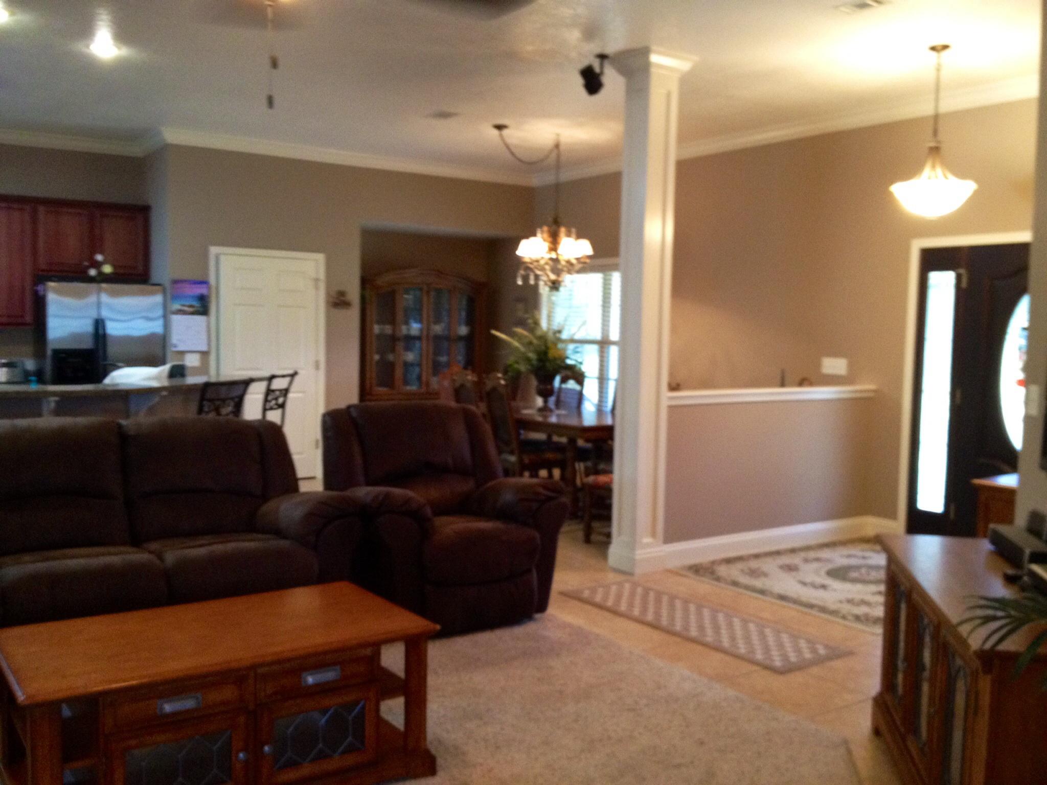 6589 Old River Road, Unit 3 ACRES Baker, FL 32531 - Photo 8 of 30 a living room with furniture a lamp and a flat screen tv
