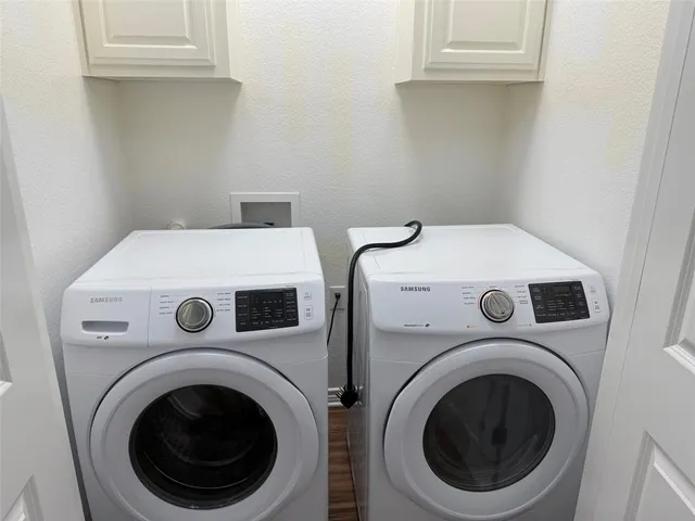 a utility room with dryer and washer