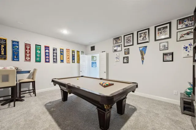 a room with furniture pool table and table