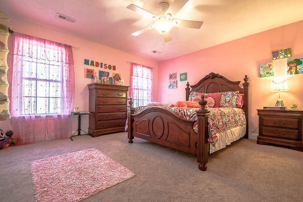 2559 Salt Pond Road Blue Ridge, VA 24064 - Photo 22 of 39 a bedroom with a bed and a chandelier