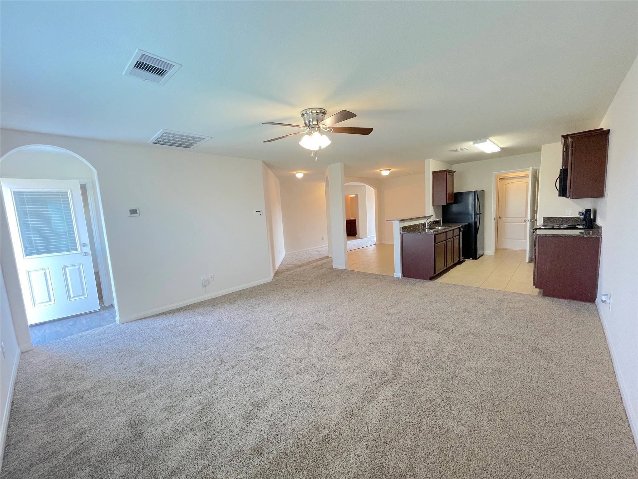 20714 Round Key Drive Hockley, TX 77447 - Photo 11 of 20 a view of a kitchen with a sink and a chandelier