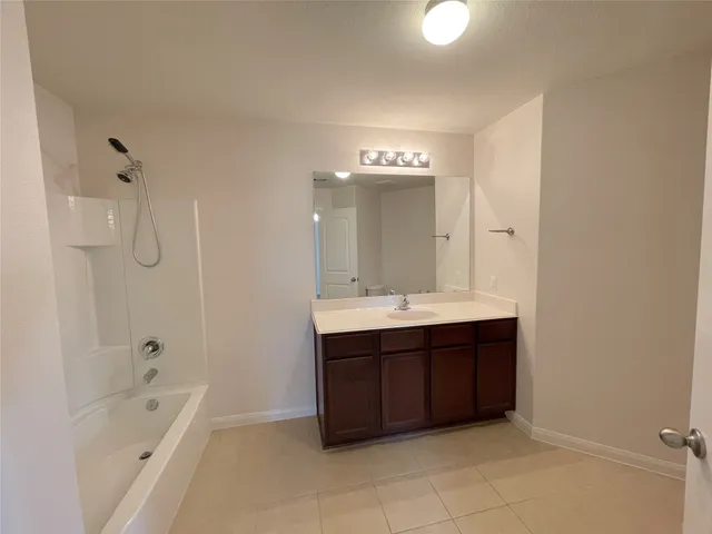 a large house with a big yard and large trees