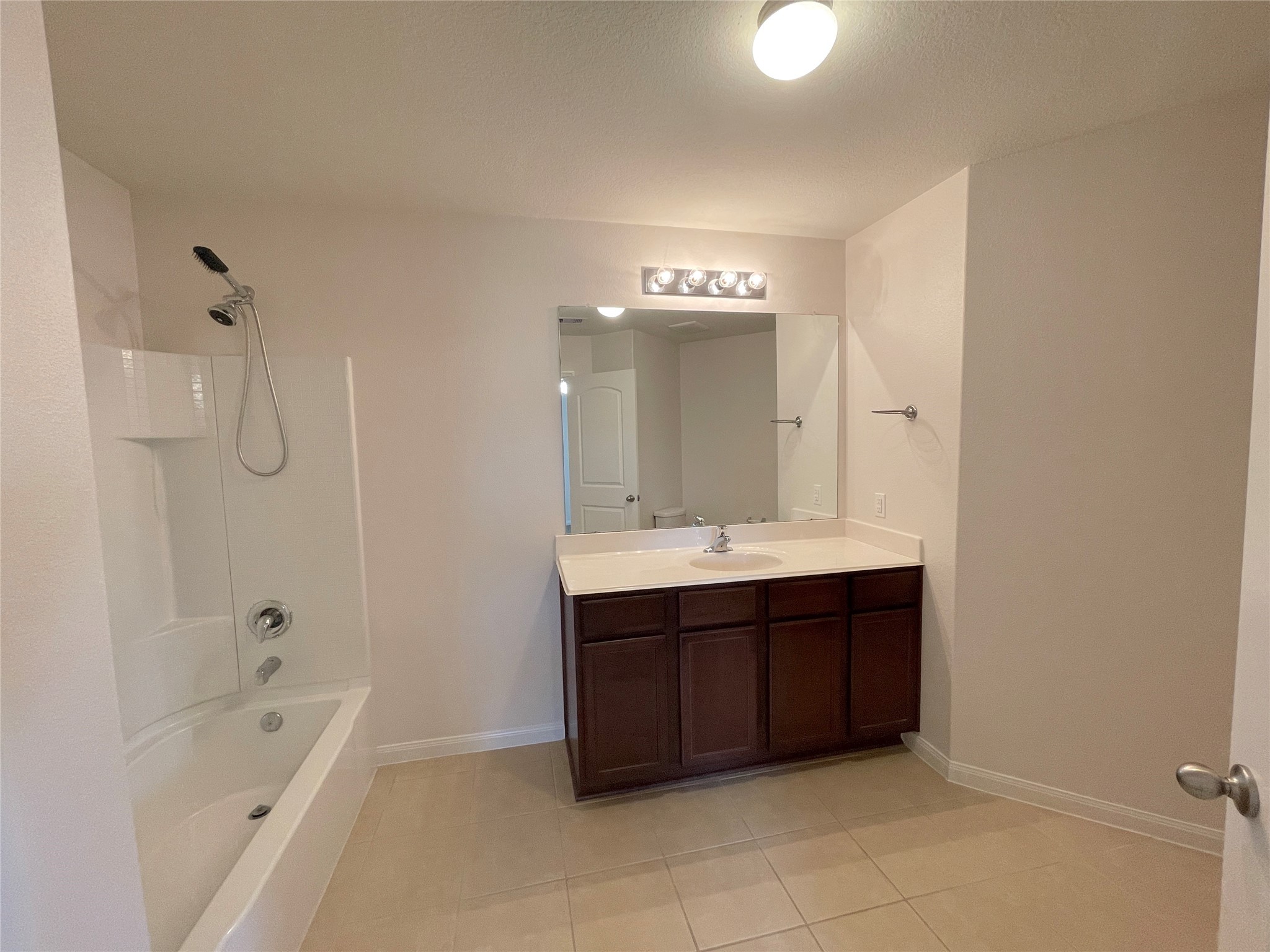 20714 Round Key Drive Hockley, TX 77447 - Photo 14 of 20 a bathroom with a tub sink and mirror