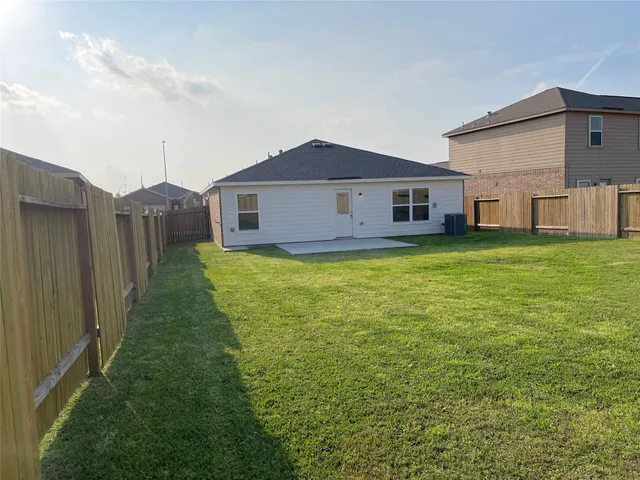 a house view with a backyard space